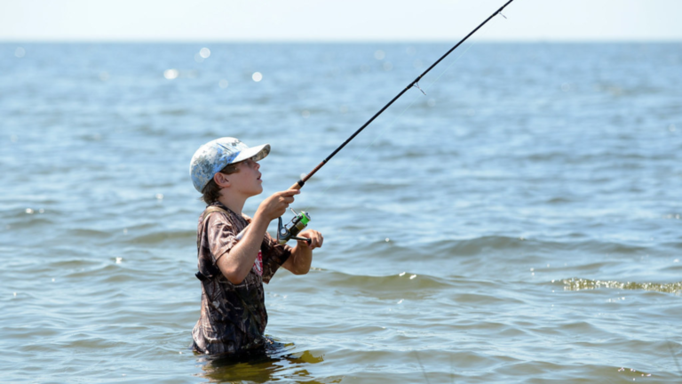 a kid fishing under the water