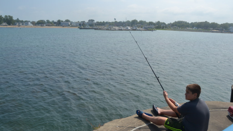 a kid fly fishing